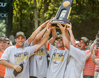 Oklahoma State players lifting the trophy